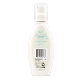 Aveeno bottle staged on bathroom shelf for an organized skincare display