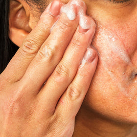 Close-up of feverfew plant extract, highlighting Aveeno calming ingredient for redness