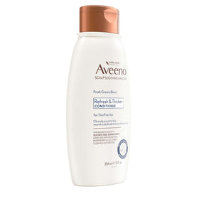 Hand holding 12 fl oz Aveeno bottle to show size and travel-friendly scale