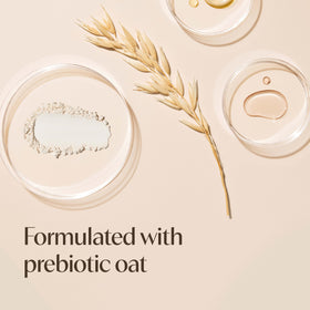 Aveeno lather on hand with pouf demonstrating smooth shave use