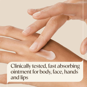 Aveeno ointment being smoothed on hands to restore moisture and protect