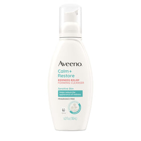 Label close-up listing ingredients and warnings on Aveeno bottle for transparency