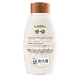 Aveeno bottle on bathroom shelf suggesting everyday hair routine