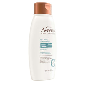 Aveeno shampoo bottle in shower portraying everyday use and moisture boost