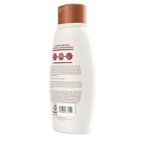 Aveeno shampoo creating lather on hair highlighting effective cleansing