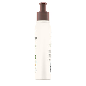 Aveeno 12 oz bottle next to hands to show true product scale