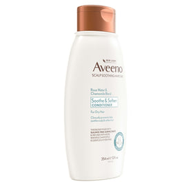 Aveeno 12 fl oz bottle next to common items to show scale and travel-friendly size