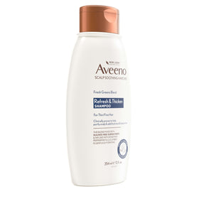 Aveeno 12 fl oz bottle next to common items for scale and size clarity