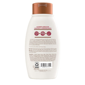 Aveeno 12 fl oz bottle beside ruler showing actual product scale