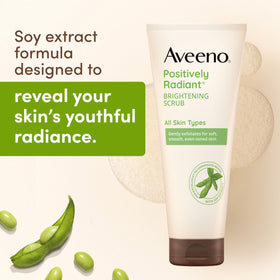 Aveeno cream squeezed on hand demonstrating creamy, non-drying formula