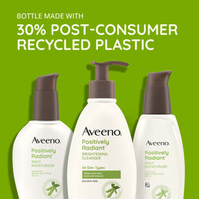 Aveeno cleanser lathered on hand showing gentle foam and cleansing action