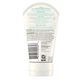 Aveeno small bottle in travel setting showing portable skincare convenience