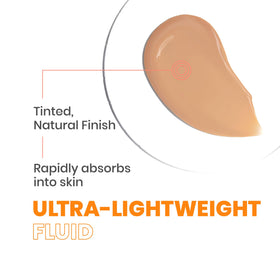 Avène applying tinted fluid on hand to show blendability and even tone benefit