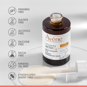 Eau Thermale Avène serum bottle beside thermal spring water reflecting soothing heritage benefit