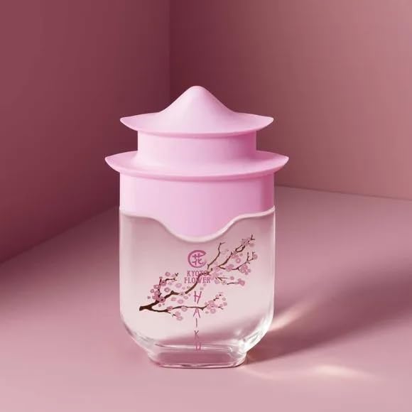 AVON bottle held in hand showing 1.7 fl oz scale and travel convenience