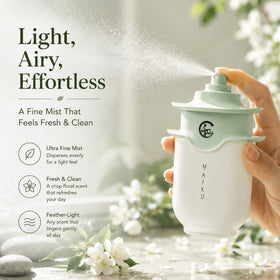Haiku bottle held in hand to show scale, AVON travel-friendly 1.7 fl oz size