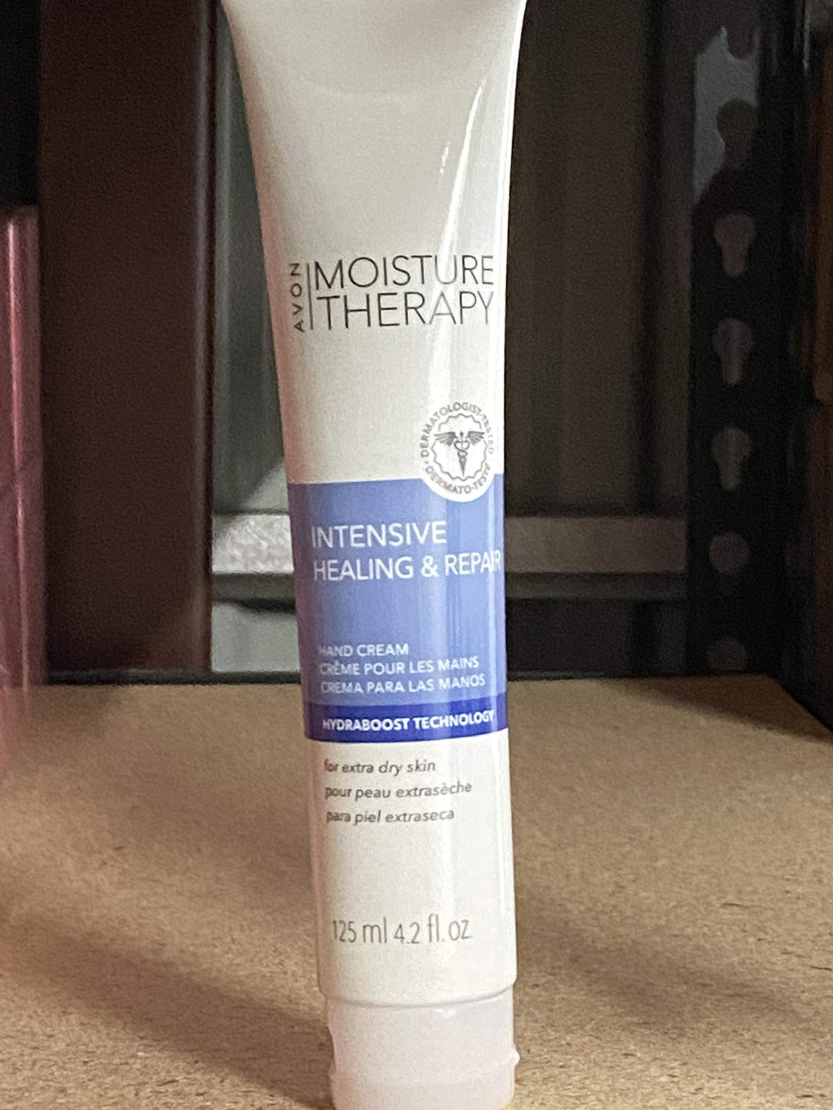 AVON tube front view showing branding and 4.2 fl oz size and long-lasting hydration