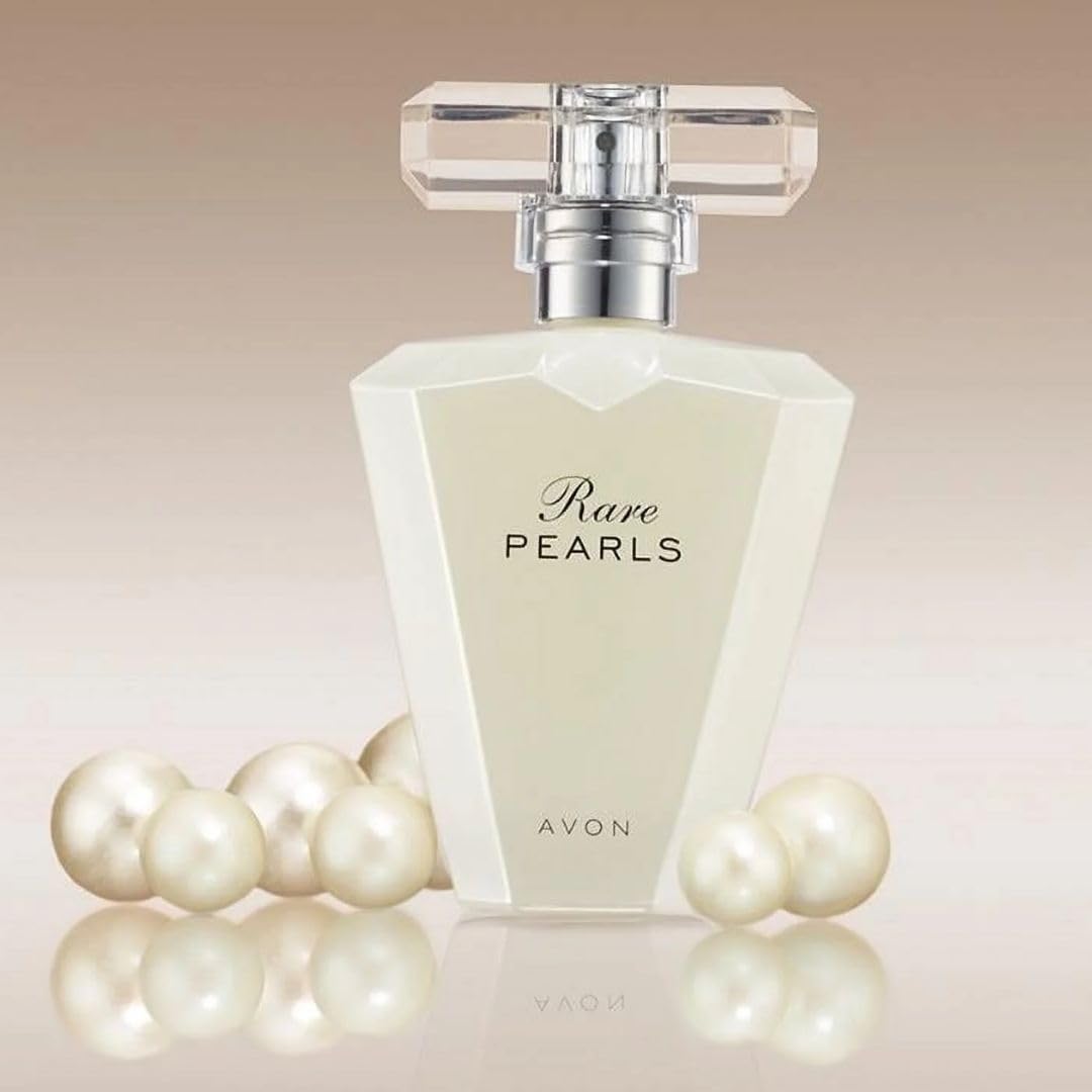 AVON bottle in hand for scale showing travel-friendly 1.7 fl oz size