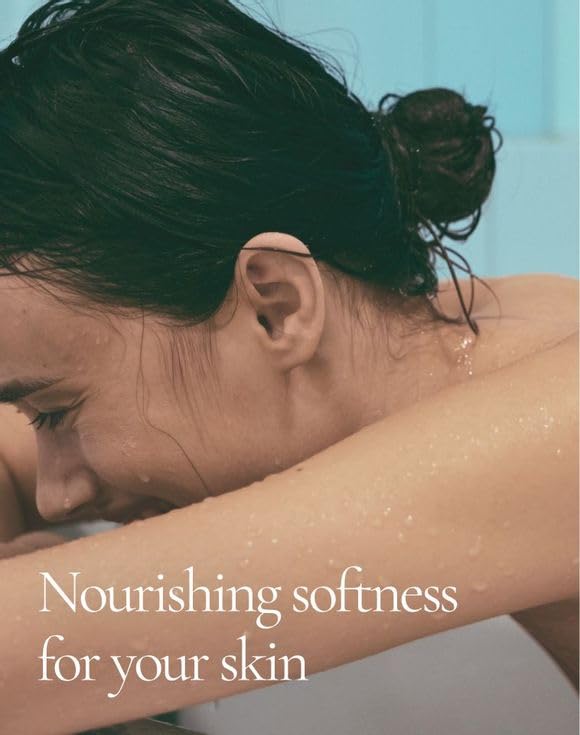 AVON Skin So Soft being applied to forearm, demonstrating quick absorption and non-greasy finish