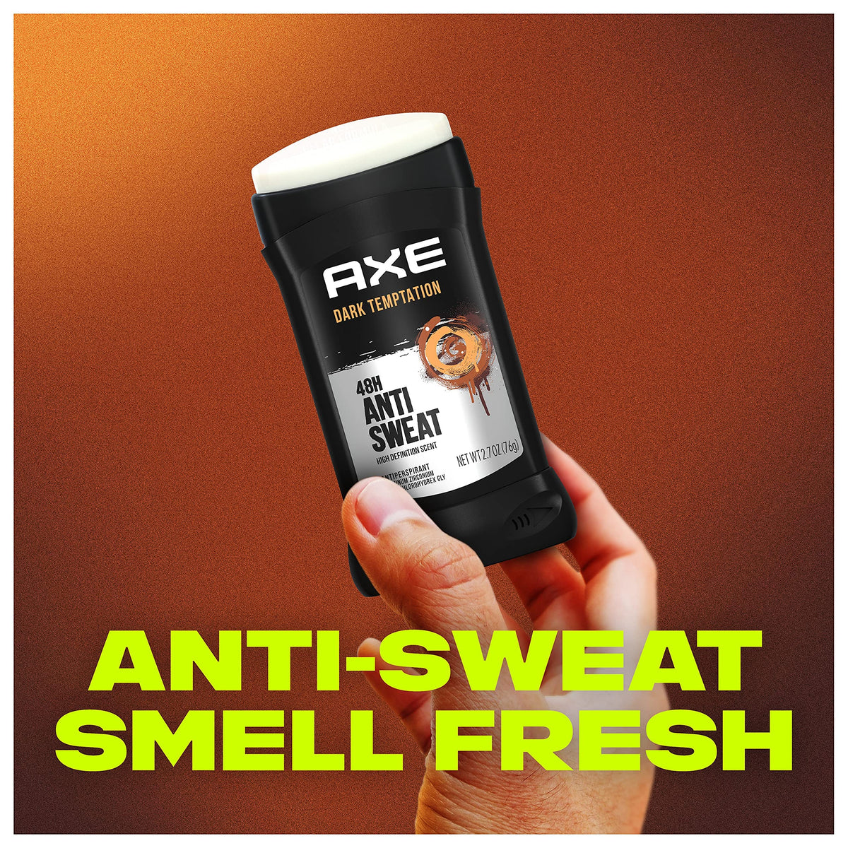AXE Dark Temptation beside coin showing 2.7 oz size and portability