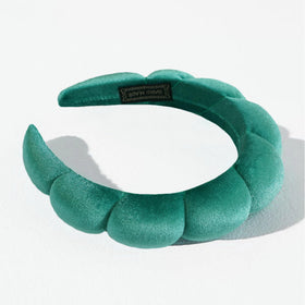 Ayesha headband stretched beside ruler showing adjustable size