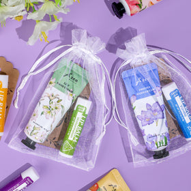 AZEN organza bag arrangement with creams and balms for elegant gifting