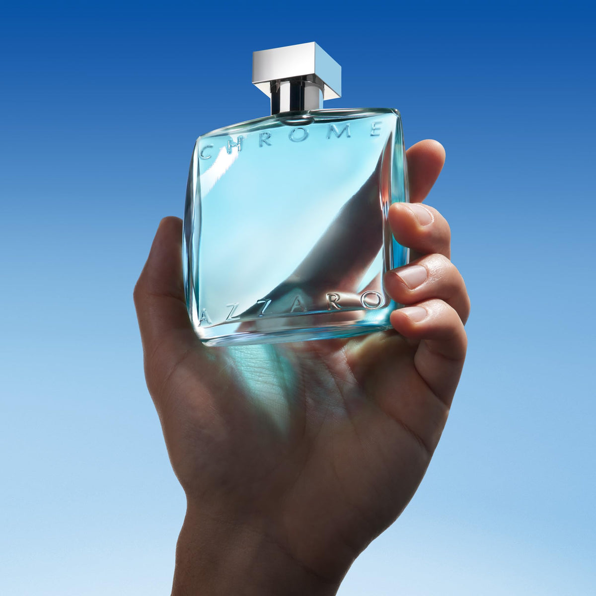 Azzaro Chrome spray in use on wrist demonstrating application and mist benefit: easy freshening