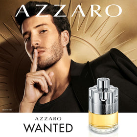 Azzaro wanted bottle next to coin for scale showing travel-size portability benefit