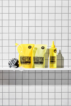 Babe Original 250 mL bottle in hand for size reference and travel-friendly benefit