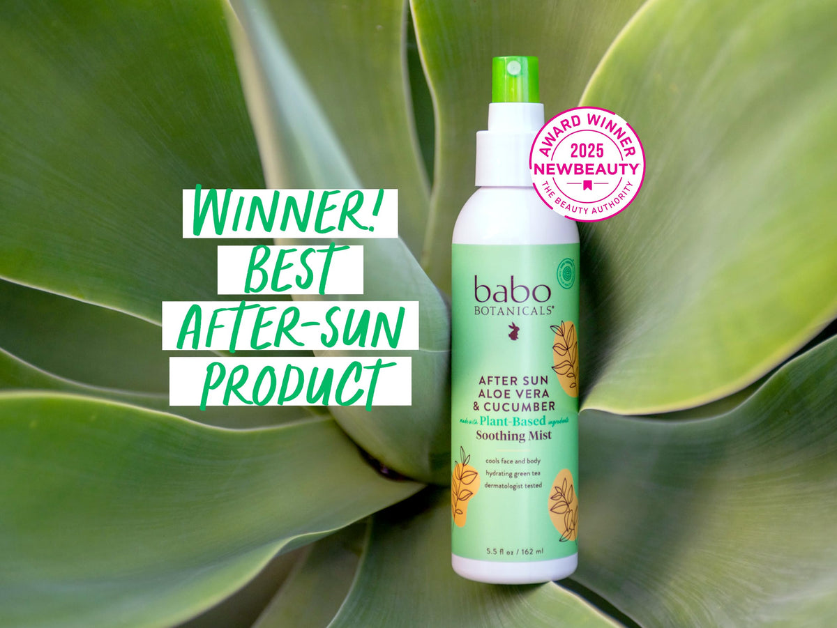 Family outdoors using Babo Botanicals mist to soothe sun-exposed skin safely