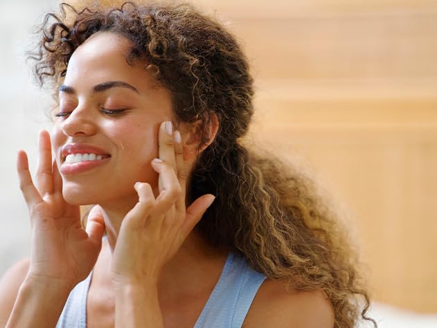 Babo Botanicals parent applying cream to baby, gentle calming benefit