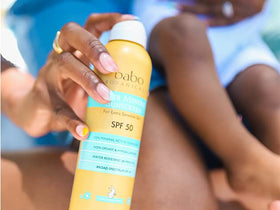 Babo Botanicals aloe vera leaf beside bottle highlighting soothing botanicals