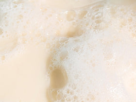 Babo Botanicals close-up of bar texture highlighting smooth, nourishing formula