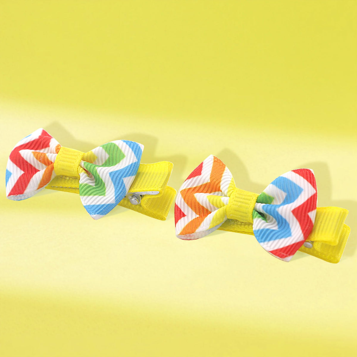 Babymatch bow clipped in infant hair, neat and comfortable