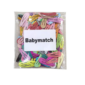 Babymatch clips arranged as party favors showing bulk convenience and variety