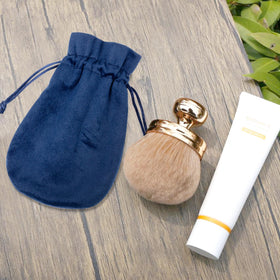 BABYSHEEP brush in beach bag lifestyle image for effortless travel-ready tanning