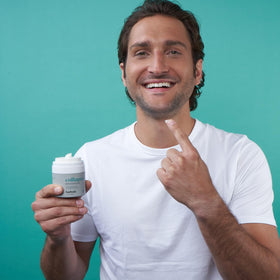 Baebody moisturizer on hand illustrating spreadability and lightweight feel