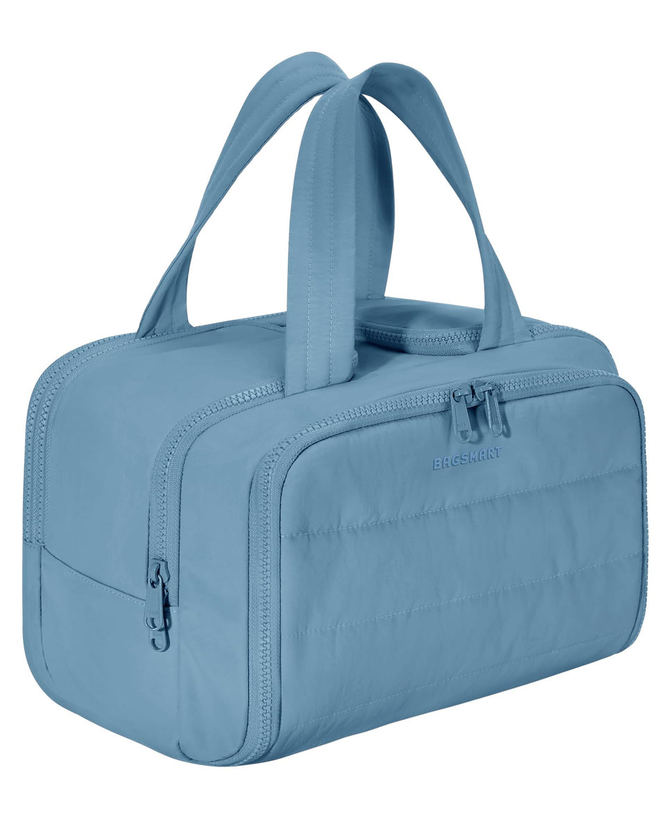 BAGSMART front view of steel blue puffy toiletry bag showing shape and zipper organization benefit
