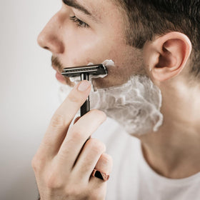 Bambaw blades next to bathroom items in lifestyle scene promoting eco-friendly grooming