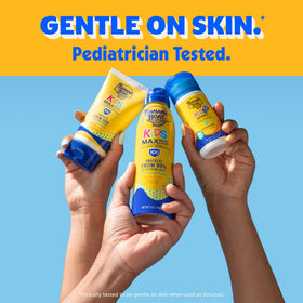 Banana Boat sunscreen spray being applied poolside for water‑resistant protection