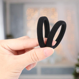 BAOLI ponytail holder in thick curly hair demonstrating secure hold during activity