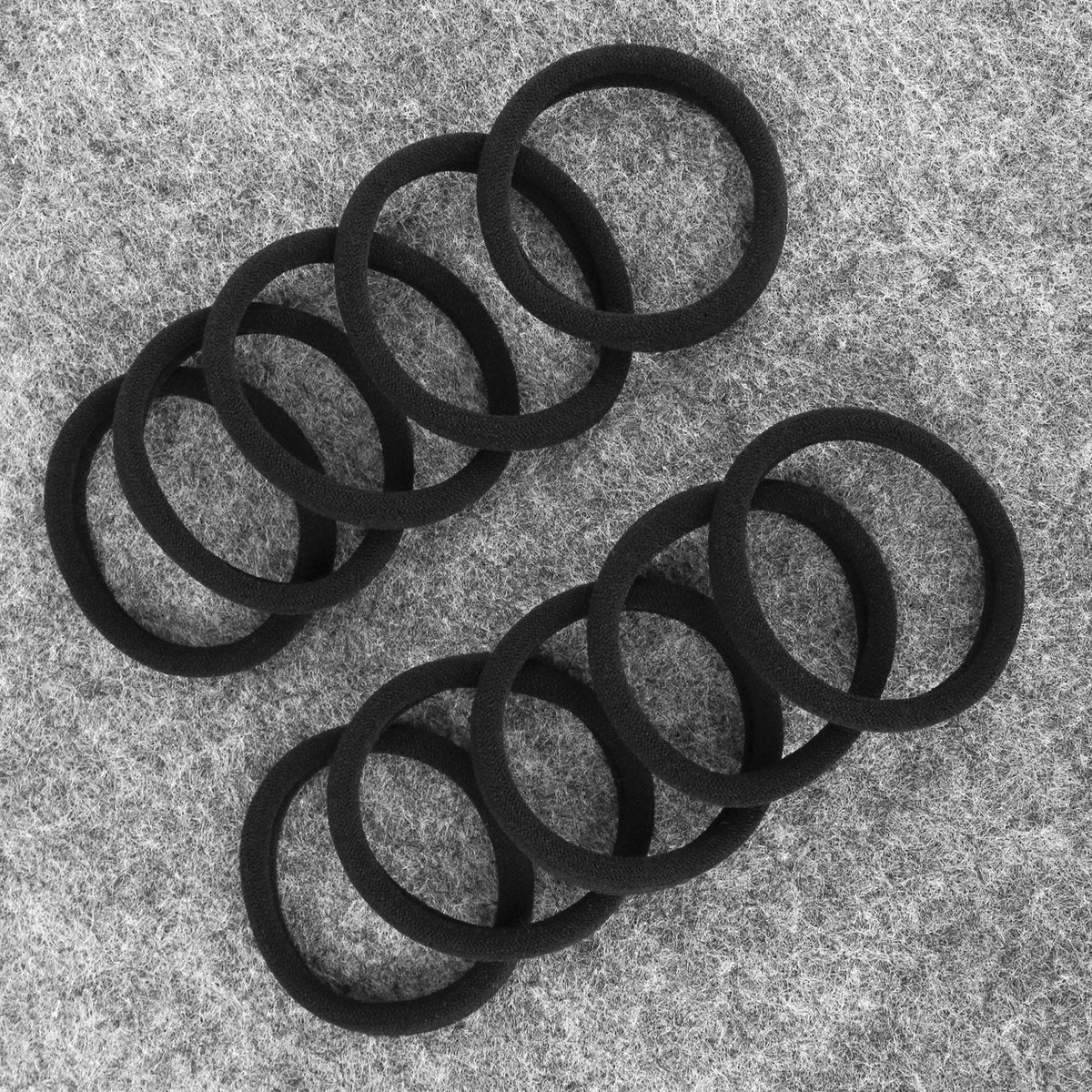 BAOLI hair tie held in hand to show 2-inch diameter scale and ease of use