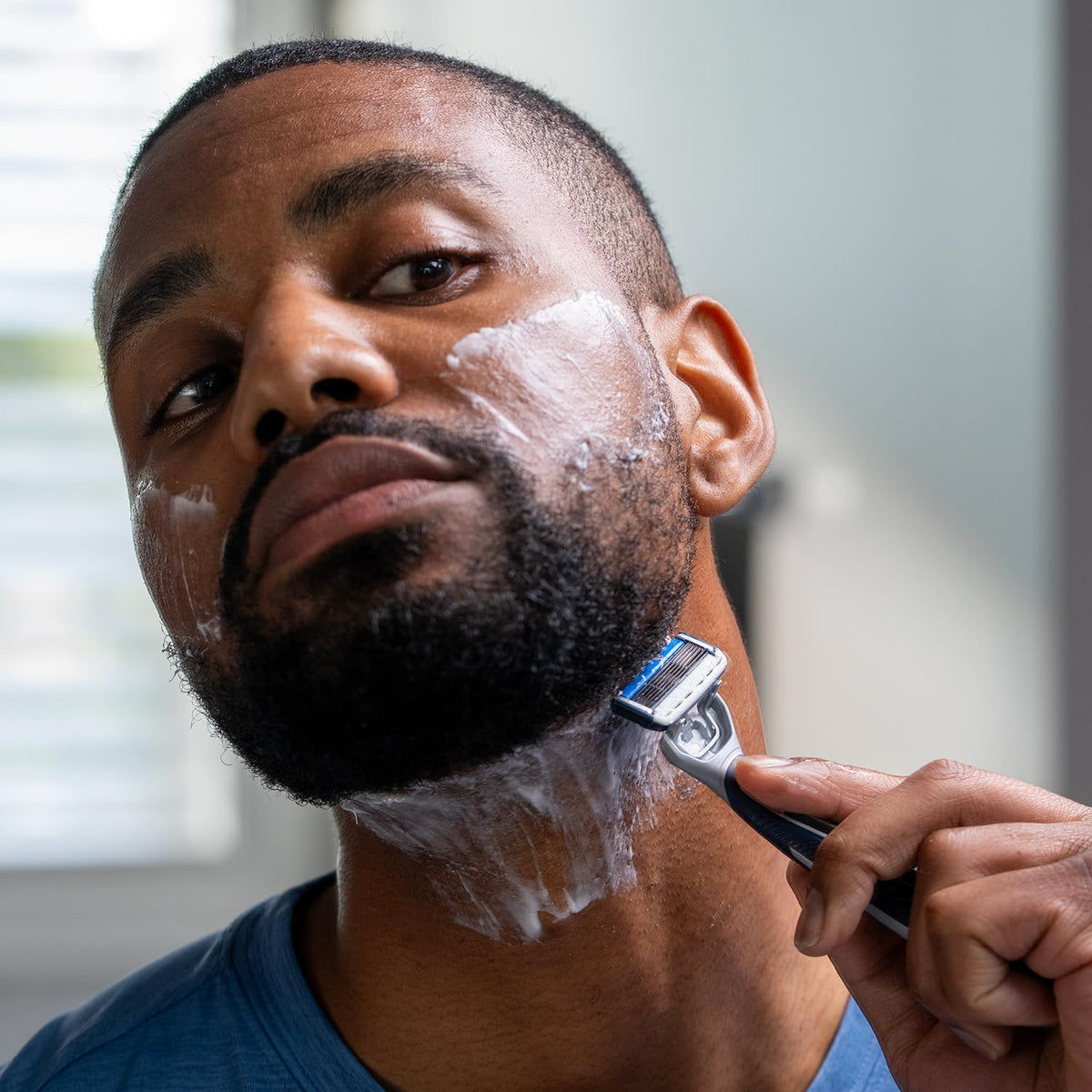 Barbasol razor on bathroom counter with shaving cream for everyday grooming