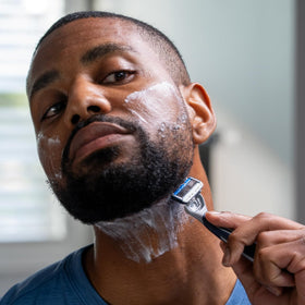 Barbasol razor on bathroom counter with shaving cream for everyday grooming