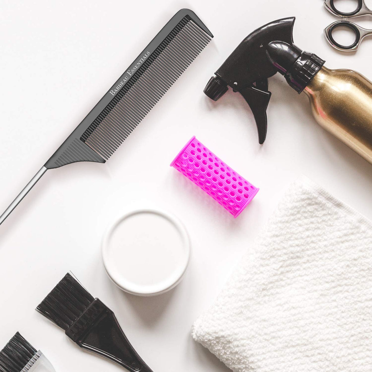 Bardeau Essentials comb held in hand showing 8.8 inch scale and ergonomic balance