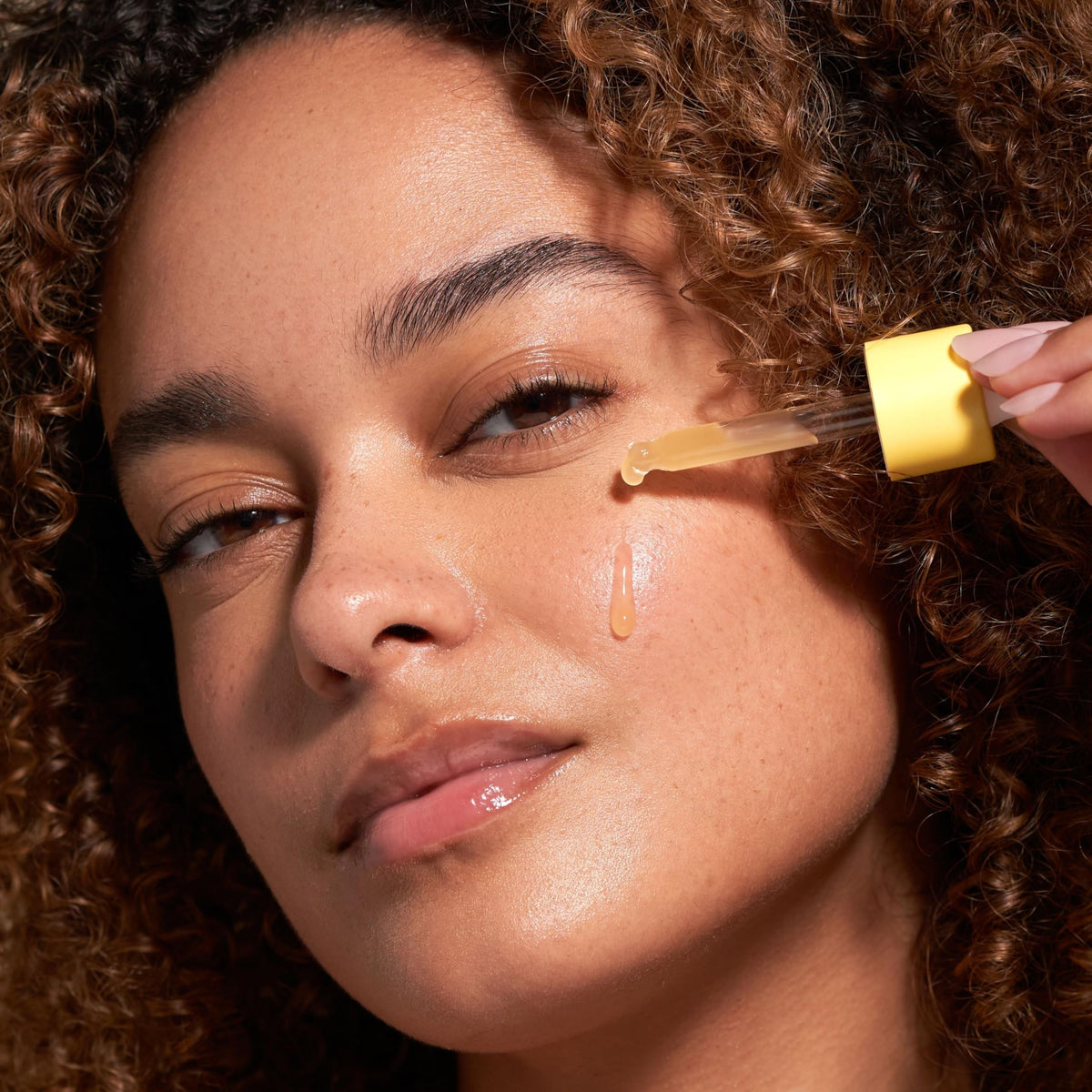 Barefaced bottle with ingredient props displaying vitamin C and hyaluronic support