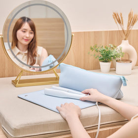 BAREFOOT CARIBOU in use with hot iron on mat demonstrating safe styling and surface protection