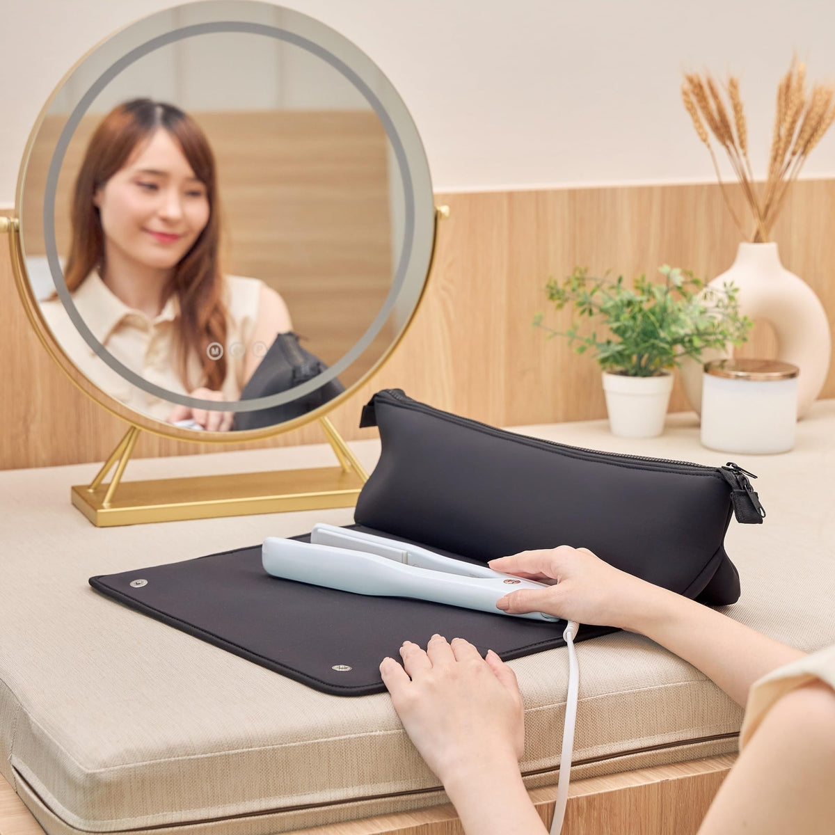 BAREFOOT CARIBOU bag in use on a bathroom counter with active iron