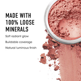 bareMinerals brush applying powder to cheek for even, buildable color
