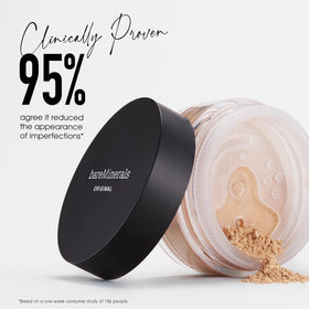 bareMinerals kabuki brush applying powder to skin for smooth, buildable coverage